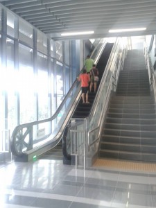 Going up the steep escalators at the MRT station