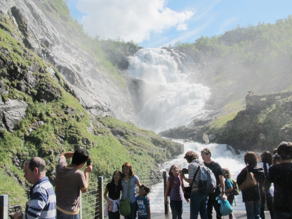 The Kjosfossen waterfall dropping down 93 metres and spraying everyone 