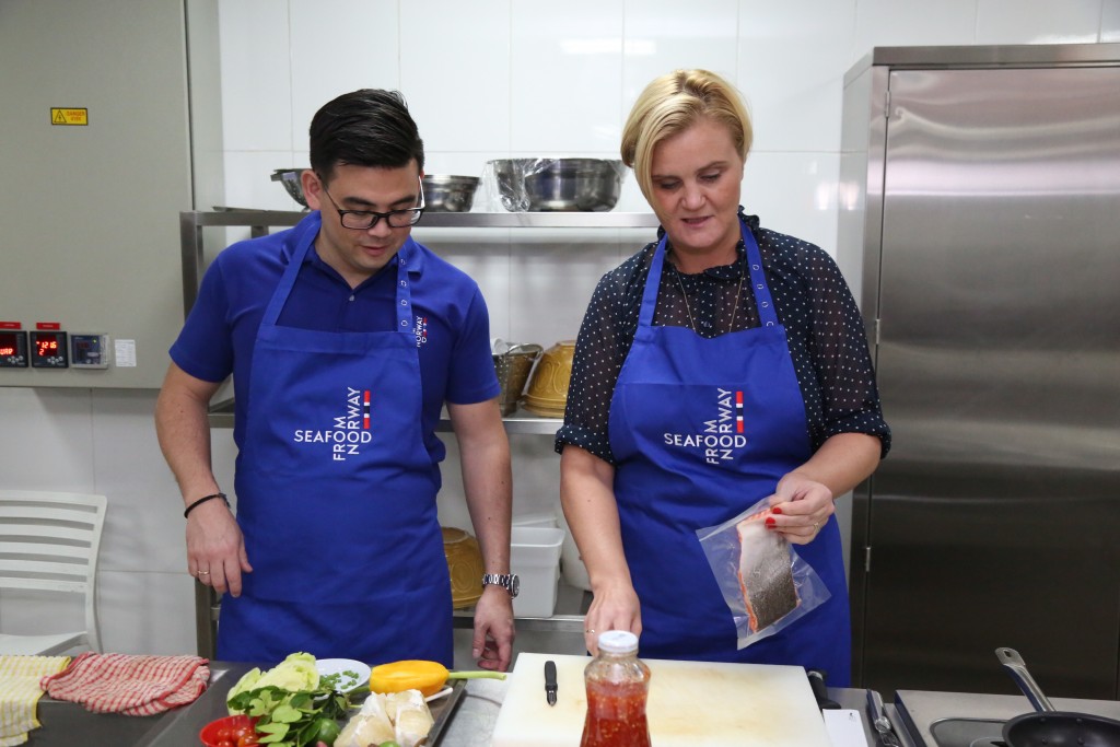 Norwegian Ambassador Gunn Jorid Roset, right, and Jon Erik getting ready to cook