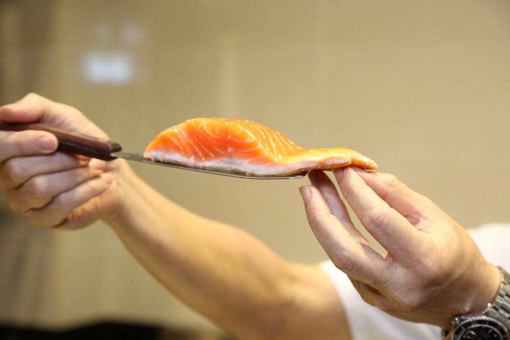 The fjord trout with a layer of white as it cooks