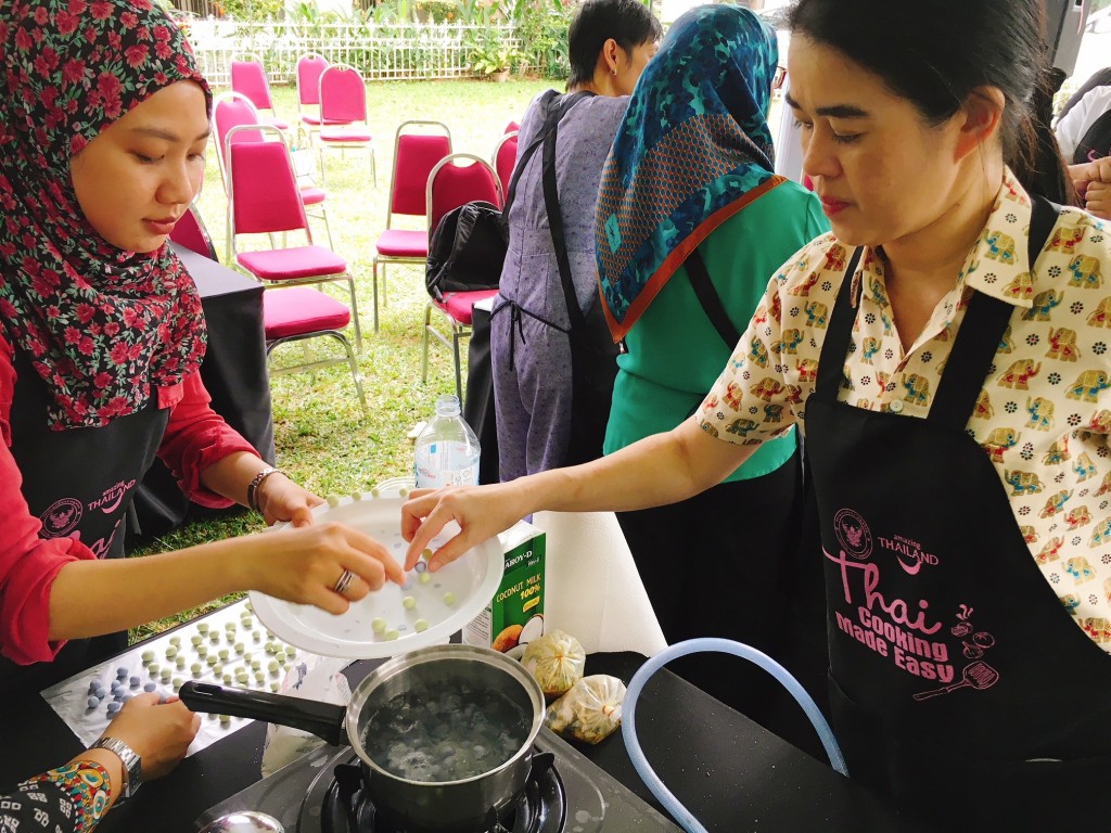 Cooking the dumplings coloured blue with the blue pea flowers