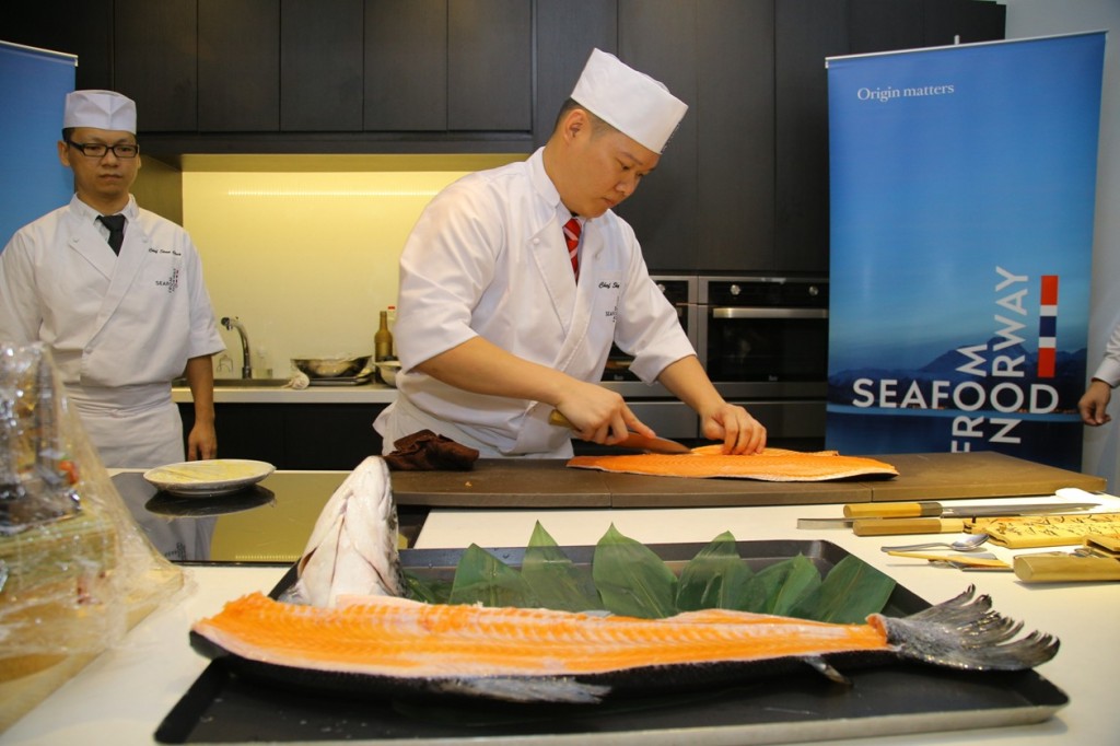 Chef Sky showing his knife skills with Norwegian salmon